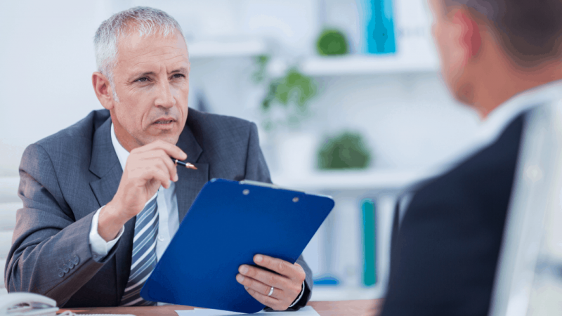 Man speaking to colleague